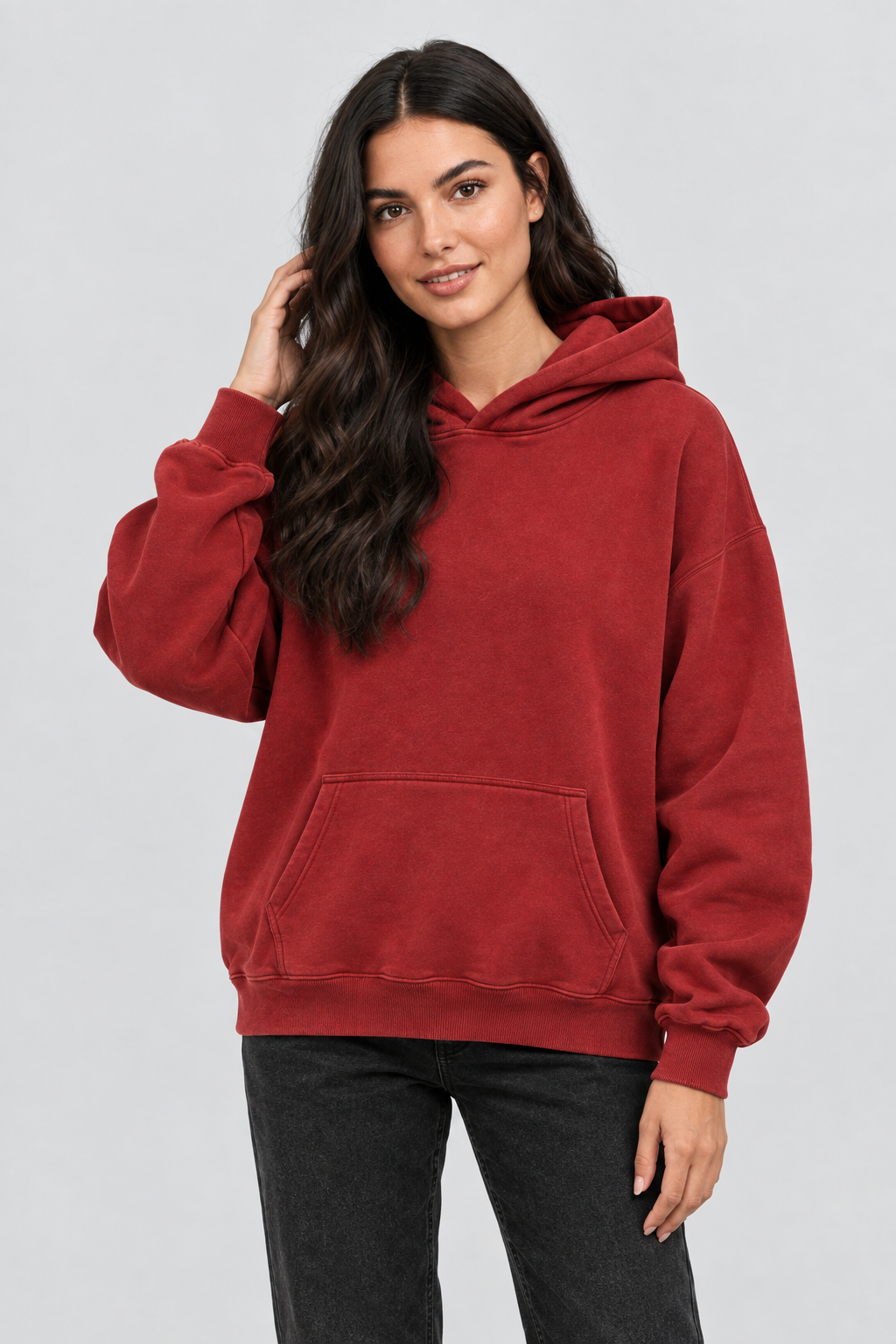 Close-up studio image of the model wearing the hoodie