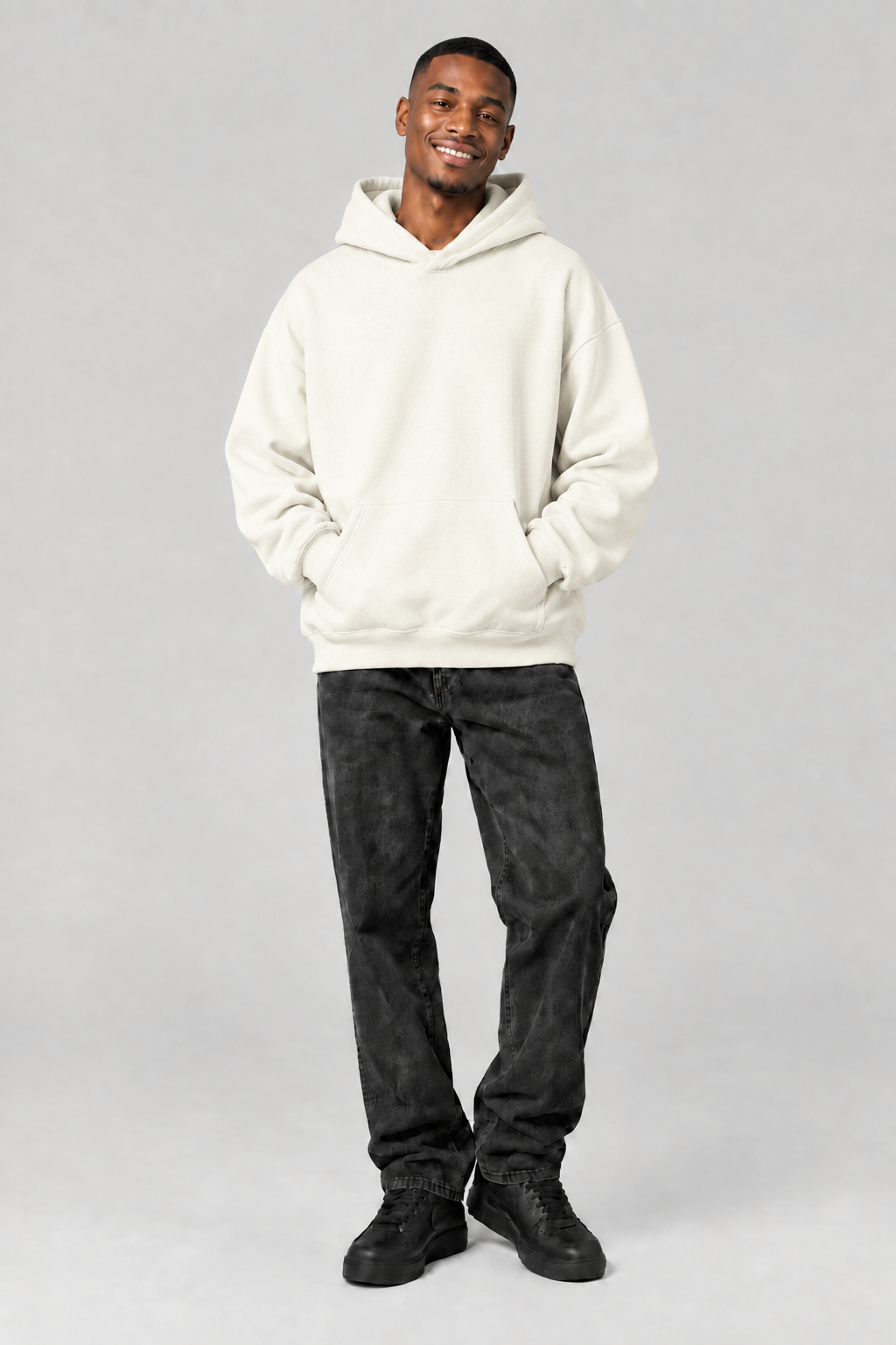 Plain black hoodie on the clean-cut smiling model